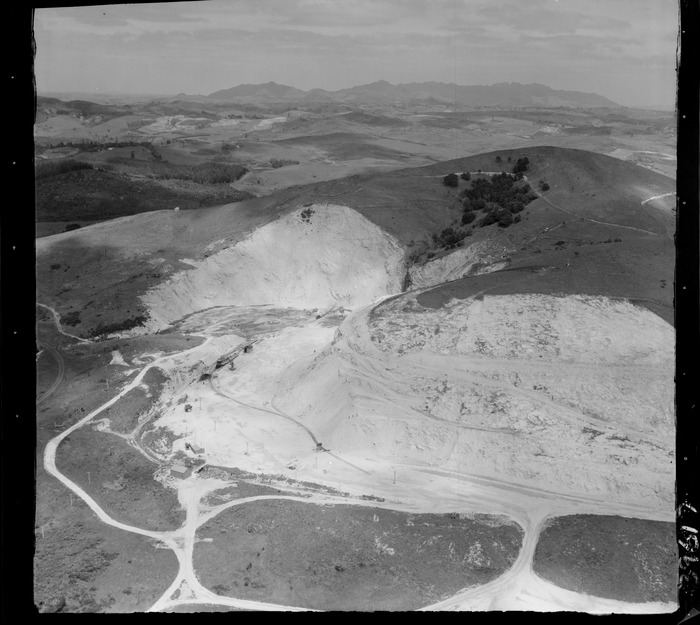 Original photograph: Portland Cement Works limestone quarry with earth digging equipment and railway, Northland