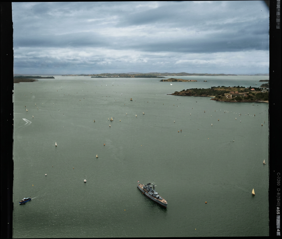AI colourised photograph: A yacht race on the Waitemata Harbour, Auckland Regatta event, with warship