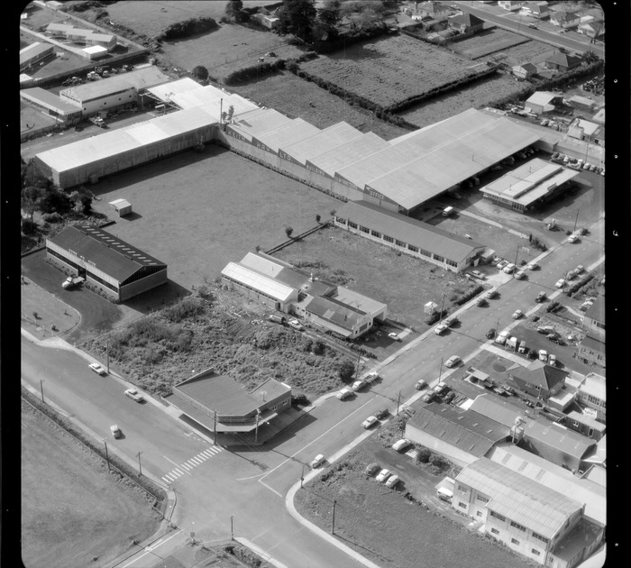 Original photograph: [Mt Roskill/Onehunga area, Auckland ?] including premises of Keith Hay Ltd and a building with the sign 'Sure To Rise'