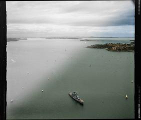 A yacht race on the Waitemata Harbour, Auckland Regatta event, with warship